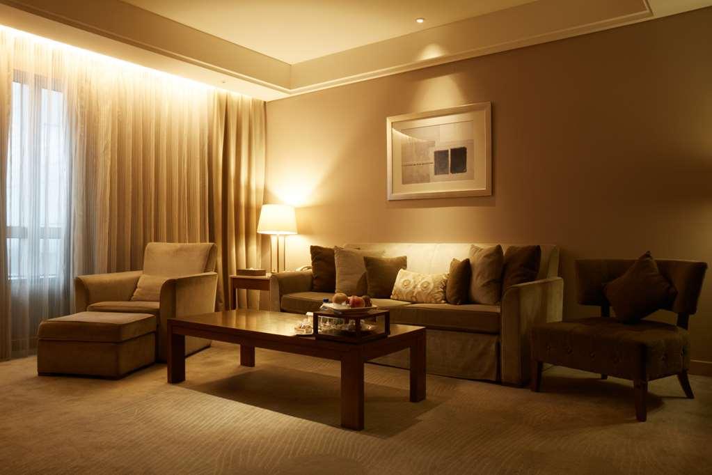 Windsor Hotel Tchaj-čung Pokoj fotografie A living room with indirect lighting